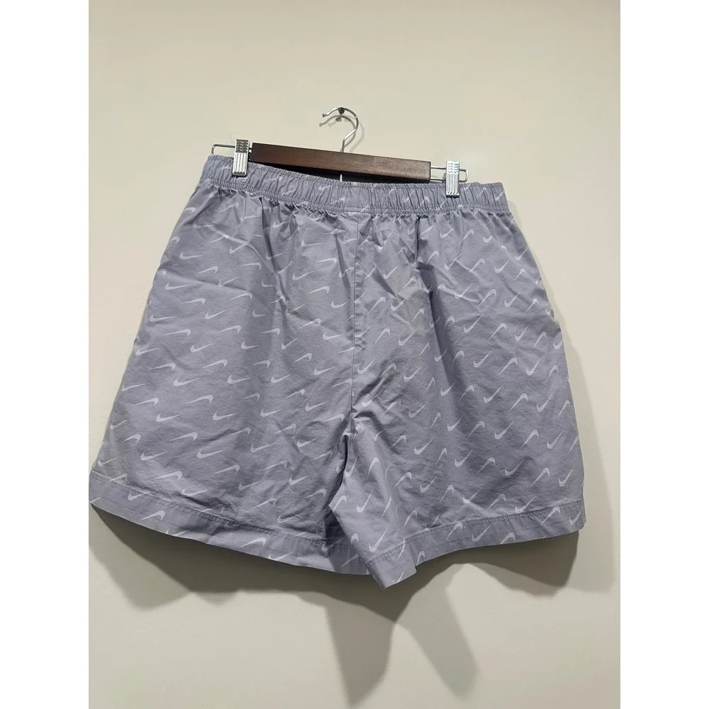 Nike women's Sportswear Woven Swoosh Shorts‎ Lavender Purple All Over Print L